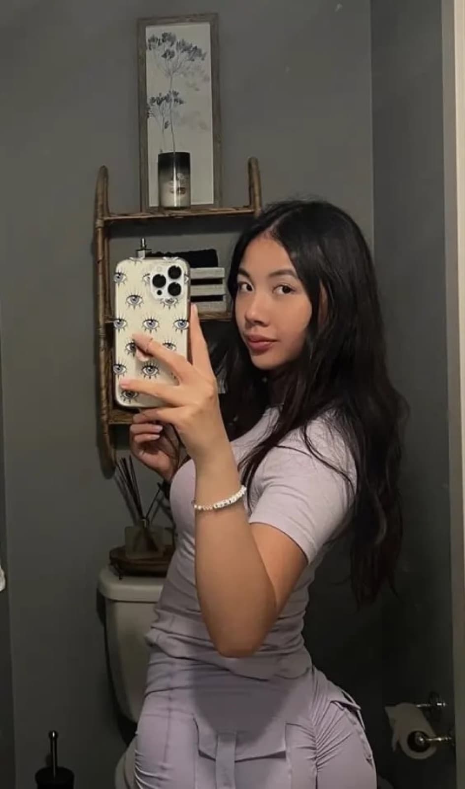 Victoria taking a mirror selfie in lilac